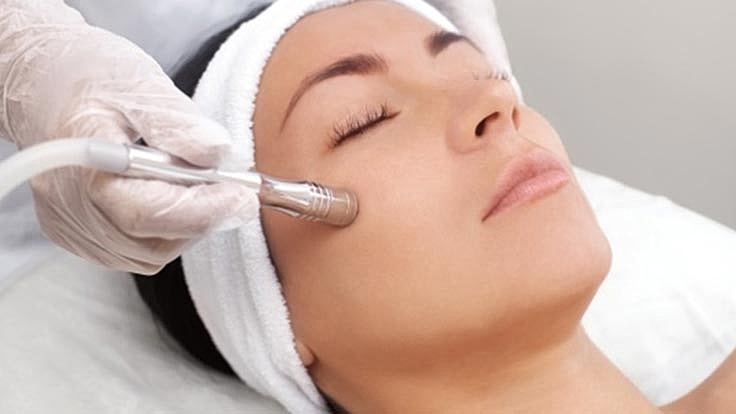 Facial treatment in progress at a spa.