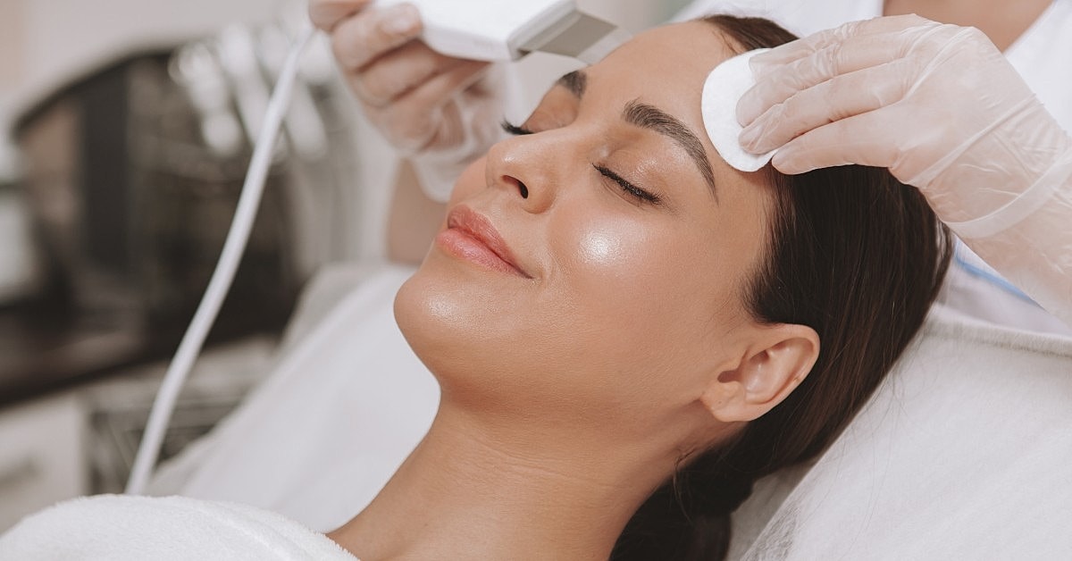 Facial treatment in a skincare salon setting.