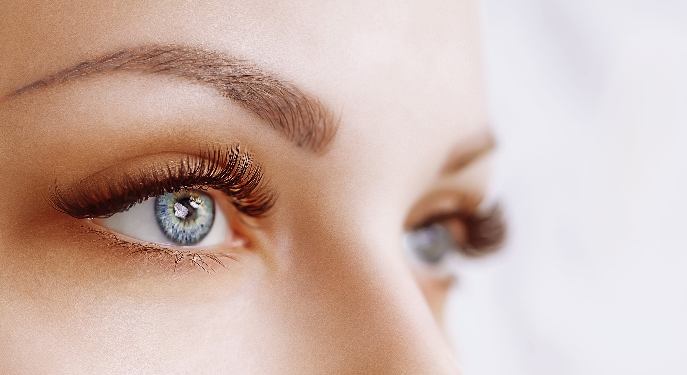 Close-up of striking blue eyes and eyelashes.