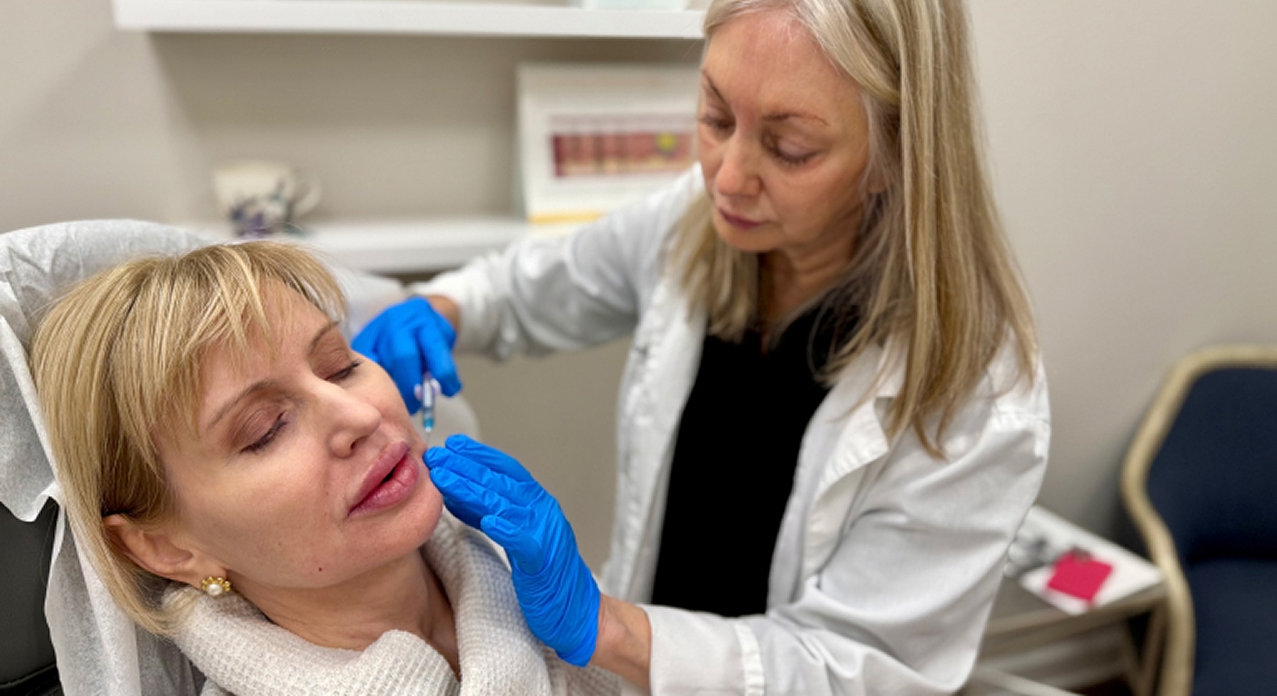 Woman receiving cosmetic treatment in a clinic.